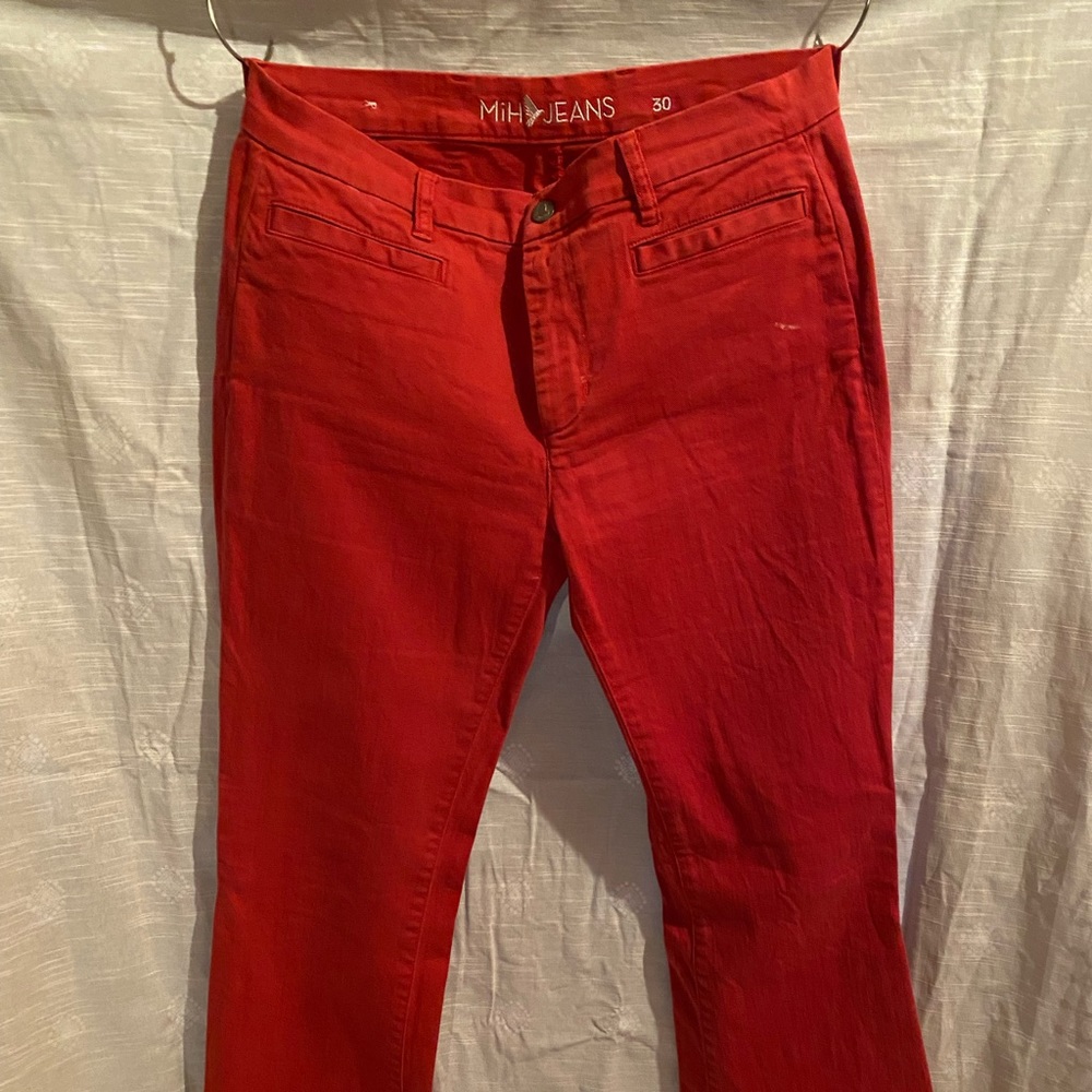 Flared jeans in  the perfect shade of red. Size 30 waist. Fabulous fabric